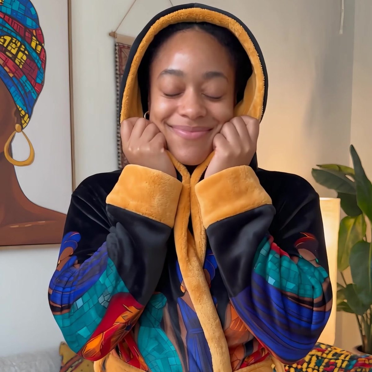 Hood up in the Rootwarm robe, warm and smiling